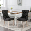 Sedia da pranzo di lusso imbottita in legno massello in lino contemporaneo con gambe in legno e borchie, set da 2 pezzi