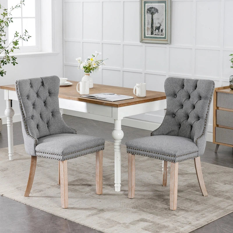 Sedia da pranzo di lusso imbottita in legno massello in lino contemporaneo con gambe in legno e borchie, set da 2 pezzi