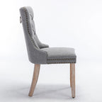 Sedia da pranzo di lusso imbottita in legno massello in lino contemporaneo con gambe in legno e borchie, set da 2 pezzi