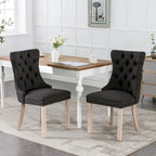 Sedia da pranzo di lusso imbottita in legno massello in lino contemporaneo con gambe in legno e borchie, set da 2 pezzi